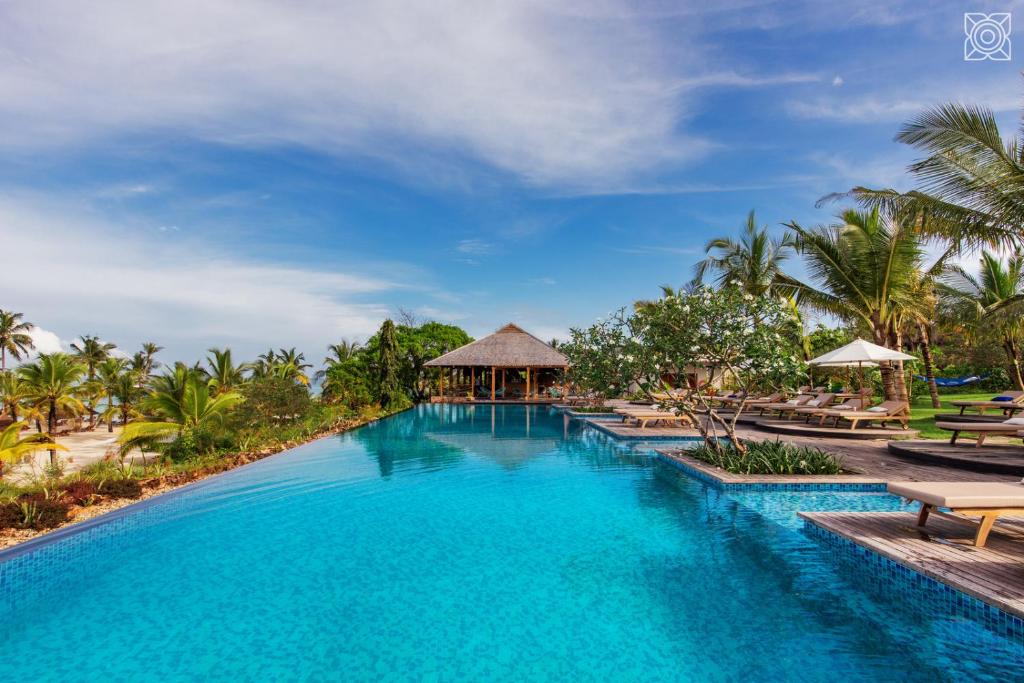 Beach bungalows and turquoise water at Zuri Zanzibar